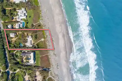 Exclusive Beachfront Sanctuary Surrounded by Lush Landscaping