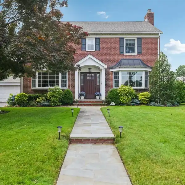 BEAUTIFULLY UPDATED AND EXPANDED BRICK COLONIAL