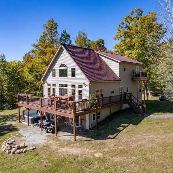 CUSTOM CHALET-STYLE HOME ON OVER TEN ACRES