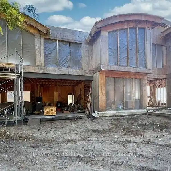 OPPORTUNITY TO COMPLETE A SPRAWLING MANSION ON NEARLY TEN ACRES