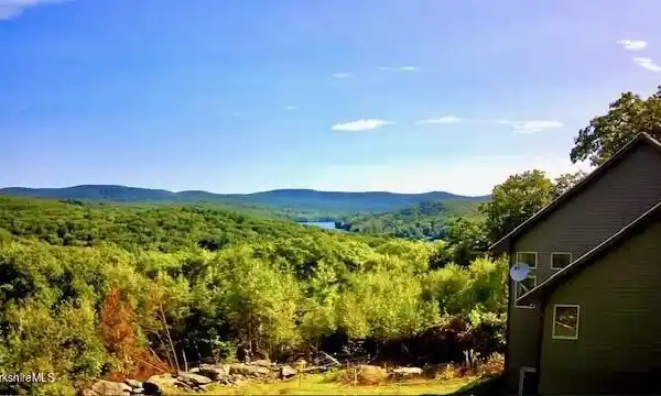 PRIVATE BERKSHIRE ESTATE WITH SWEEPING MOUNTAIN AND LAKE VIEWS
