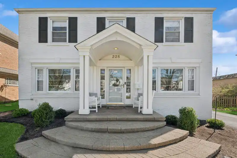 Stunningly Updated White Painted Brick Colonial