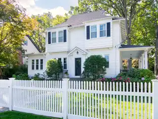 Stunning White Colonial Sits on Beautiful Corner Lot