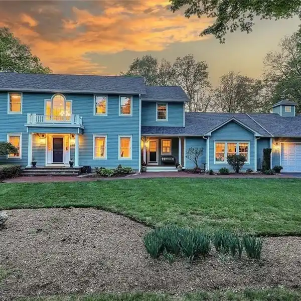 STUNNING COLONIAL ON NEARLY TWO WOODED ACRES
