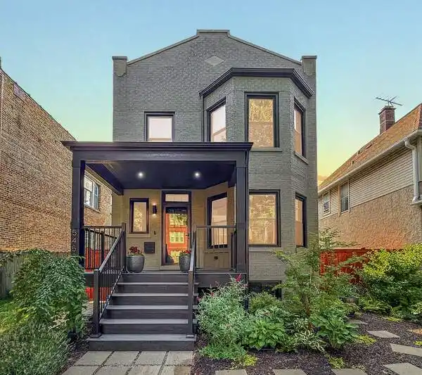 METICULOUSLY TRANSFORMED THREE-FLAT INTO SINGLE-FAMILY