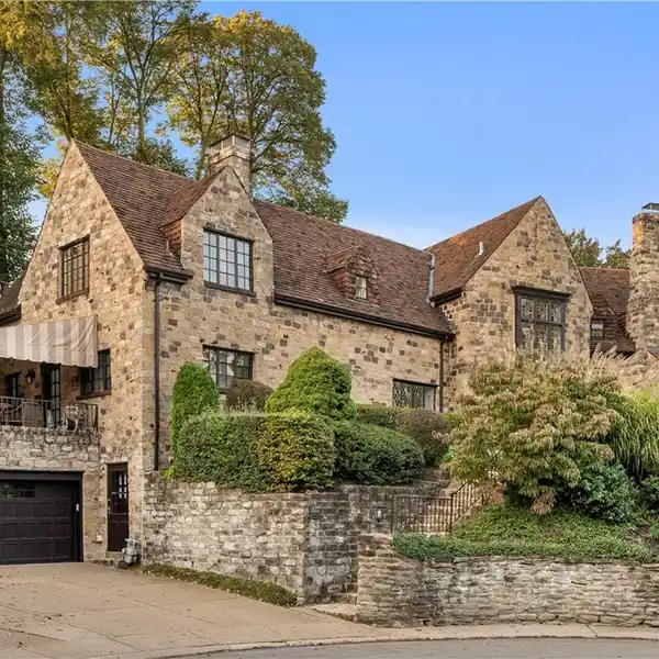 EXQUISITE STONE ESTATE ON A COVETED CUL-DE-SAC