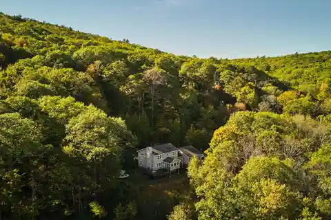 Serene Estate Surrounded by Forest and Rock Outcroppings
