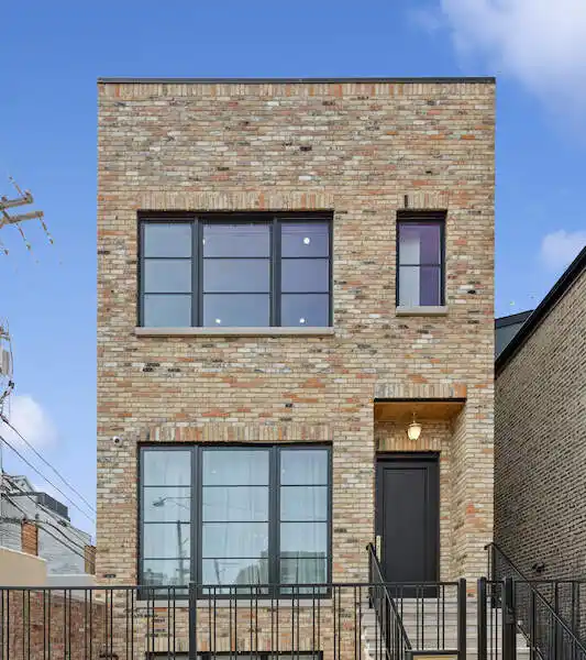 CUSTOM BRICK BEAUTY WITH LUXE FINISHES THROUGHOUT