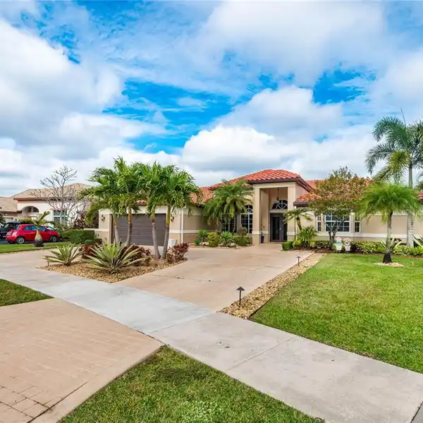 BEAUTIFUL FOUR BEDROOM POOL HOME ON THE LAKE AWAITS YOU