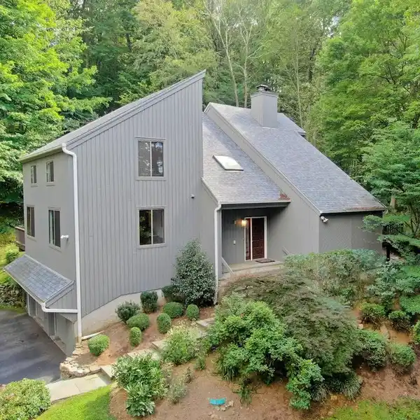 MODERN COMFORT ENVELOPED BY WOODED PRIVACY