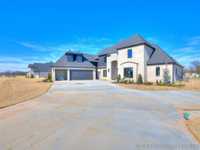 ONE-OF-A-KIND NEW CUSTOM HOME ON A LARGE LOT IN SOUTH BIXBY