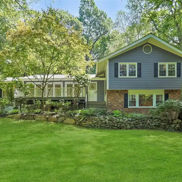 STRIKING FRAME AND BRICK-FRONT SPLIT-LEVEL HOME