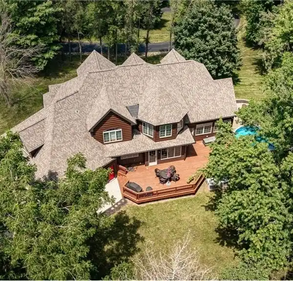 EXQUISITE CUSTOM HOME ON TWO WOODED ACRES