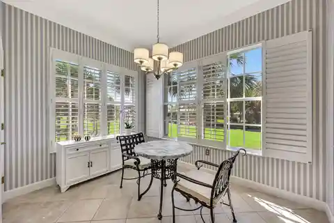 Upper-Floor End Unit with Panoramic Golf and Water Views