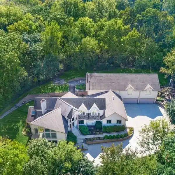 EXPANSIVE RIVERFRONT ESTATE WITH YEAR-ROUND RESORT LIVING