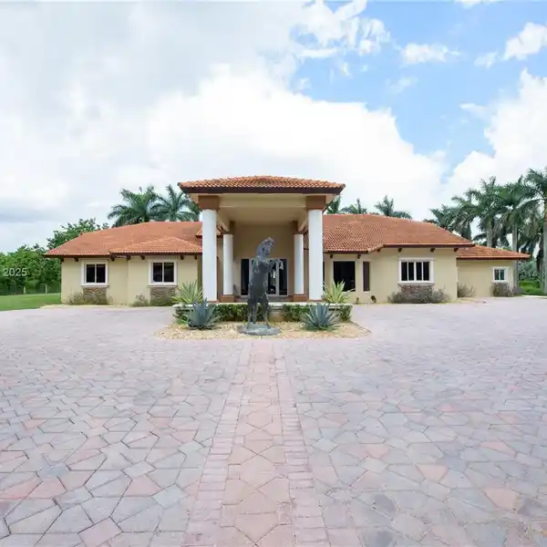 EXQUISITE GATED RESIDENCE ON OVER FOUR ACRES
