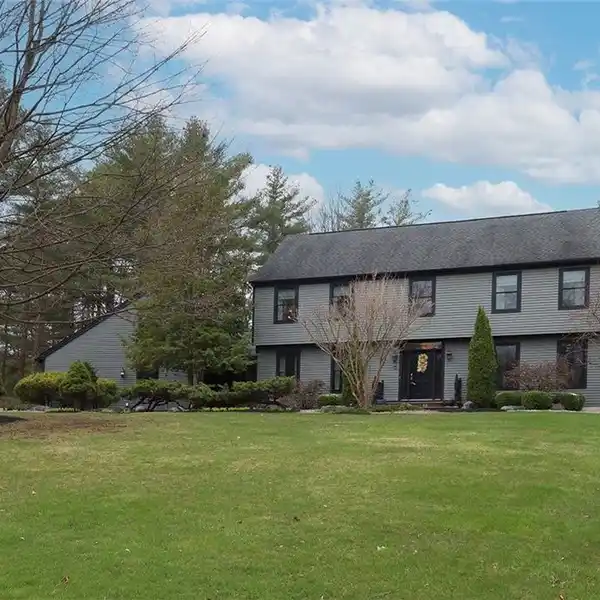 UPDATED COLONIAL ON A BEAUTIFULLY LANDSCAPED ACRE