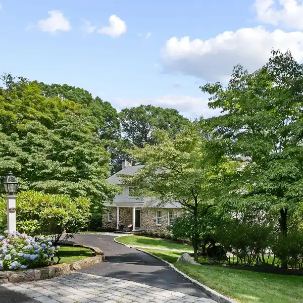 PRISTINE STONE AND SHINGLE COLONIAL HOME ON TWO ACRES