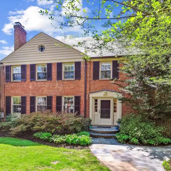 STATELY FOUR-LEVEL BRICK COLONIAL