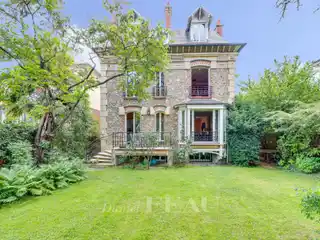 Stone Home with Lush Garden