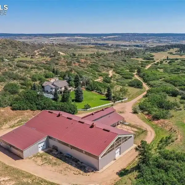 SOPHISTICATED RANCH HOME WITH CUSTOM ARENA AND BARNDOMINIUM