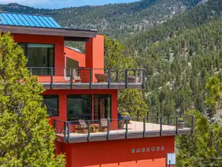 Eco-modern Escape with Forest, Stream, and Pond