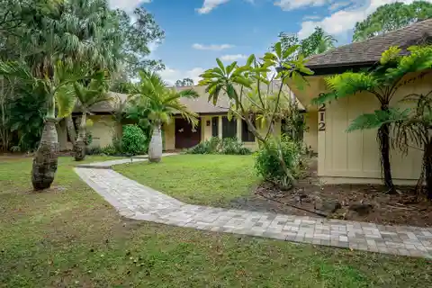 Rare Canal-front Find in Palm Beach Country Estates
