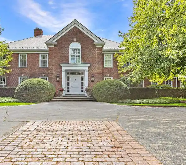 TIMELESS BRICK GEORGIAN ESTATE ON A PICTURESQUE LOT