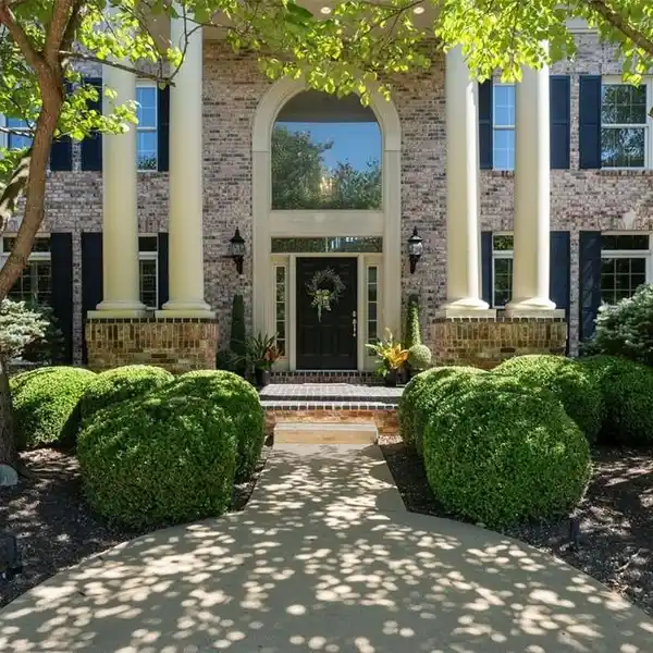 GRAND RESIDENCE WITH SUNLIT ARCHITECTURAL DRAMA