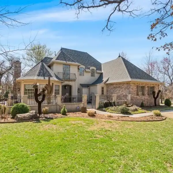 CUSTOM HOME IN THE EXCLUSIVE GATED EDINBOROUGH POINTE COMMUNITY