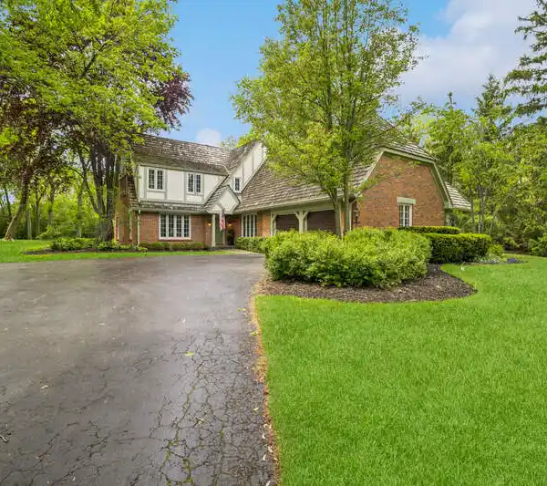 REFINED LIVING MEETS PRIVACY IN THIS SPACIOUS LAKE FOREST RETREAT