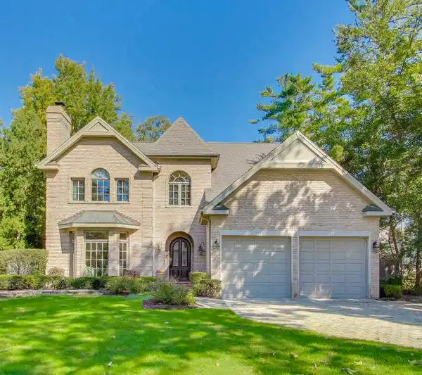 CUSTOM ALL-BRICK RETREAT IN COVETED GLEN OAK ACRES