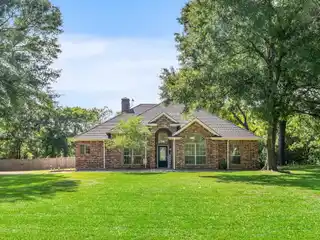 Rare Waterfront Acreage with Open Layout Home