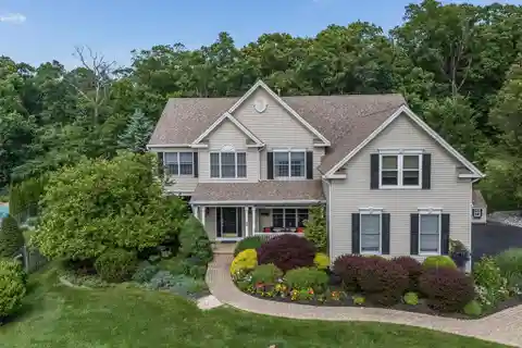 Meticulously Updated Colonial with Gourmet Kitchen & Gym