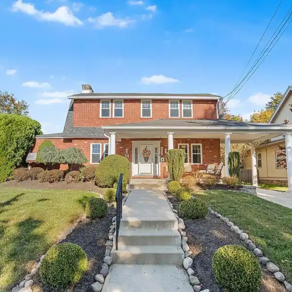 EXCEPTIONAL BRICK HOME WITH ENTERTAINER’S DREAM LAYOUT