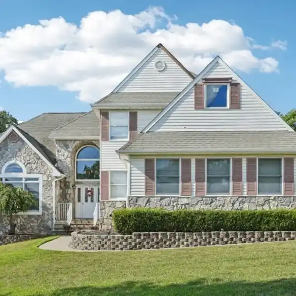 EXQUISITE COLONIAL HOME IN COBBLESTONE WOODS