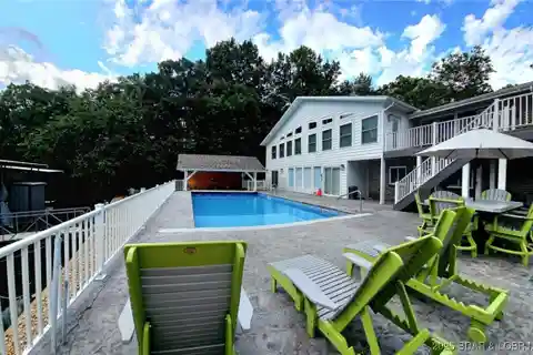 Gated Lakefront Retreat with Entertainer’s Dream