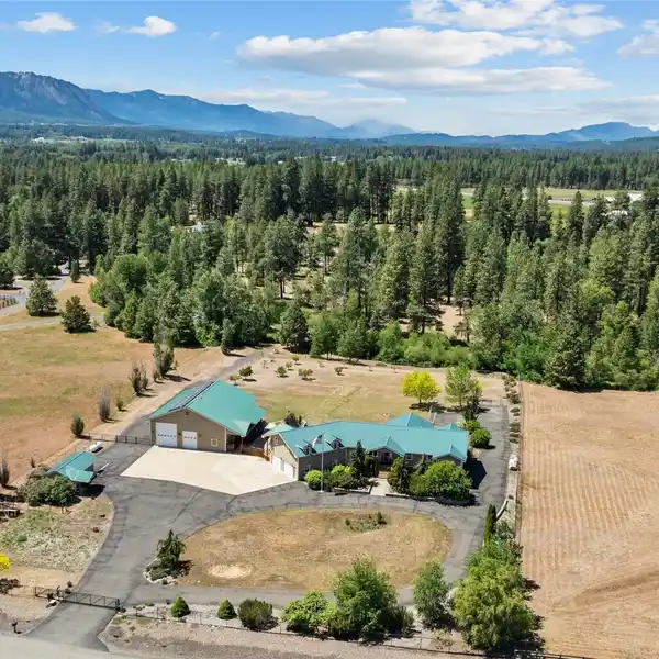 LUXURY RIVERFRONT LIVING ON NEARLY SIX ACRES