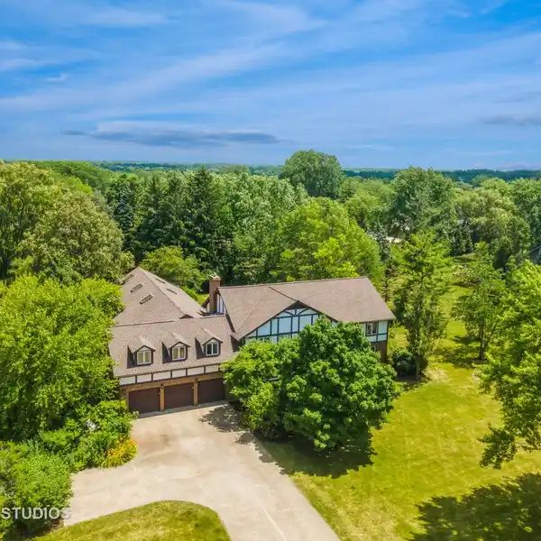 EXPANSIVE TUDOR ESCAPE WITH INDOOR HEATED POOL