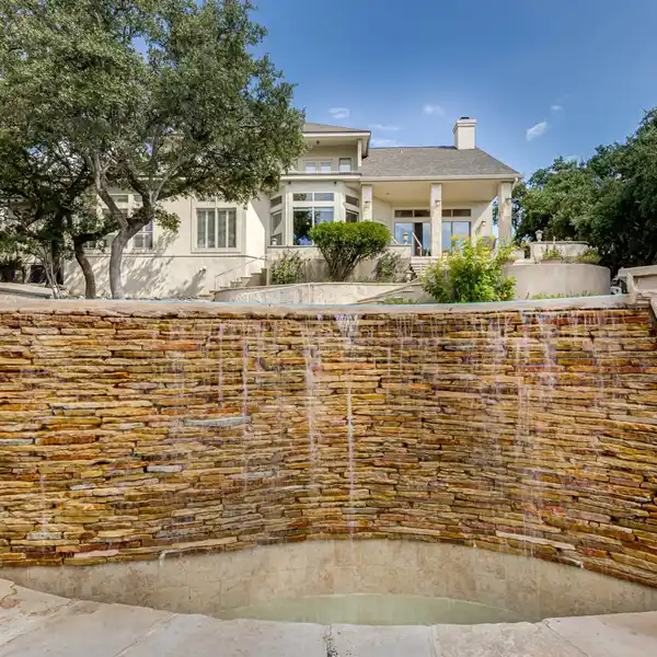 EXCLUSIVE HILL COUNTRY RETREAT WITH INFINITY POOL AND WATERFALL
