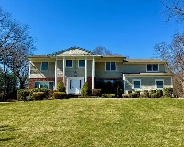 CENTER HALL COLONIAL IN A PRIME LAUREL HOLLOW LOCATION