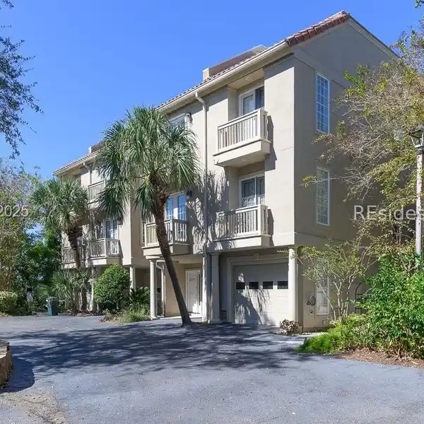 SOPHISTICATED INTERIORS FEATURING HIGH CEILINGS AND WOOD FLOORS