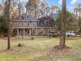All Brick Estate Home in Sought-after Enchanted Oaks