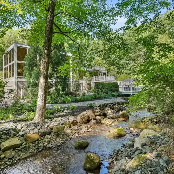 UNIQUE THREE-LEVEL RETREAT WITH EXPANSIVE DECKS