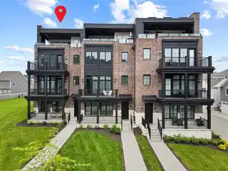 Distinctive Brownstone at the River's Edge
