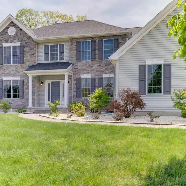 CUSTOM-BUILT COMFORT WITH DUAL STAIRCASES