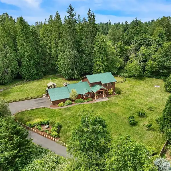 CUSTOM CEDAR HOME ON SEVEN PRIVATE ACRES