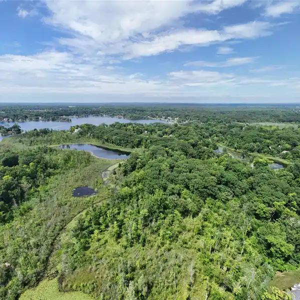 13.5-ACRE WOODED SANCTUARY ON COMMERCE LAKE
