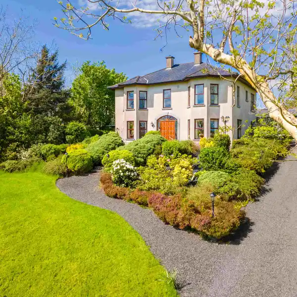 WELL-APPOINTED HOME WITH OUTBUILDINGS