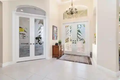 Custom Home on a Lush Private Acre in Bay Hill Estates